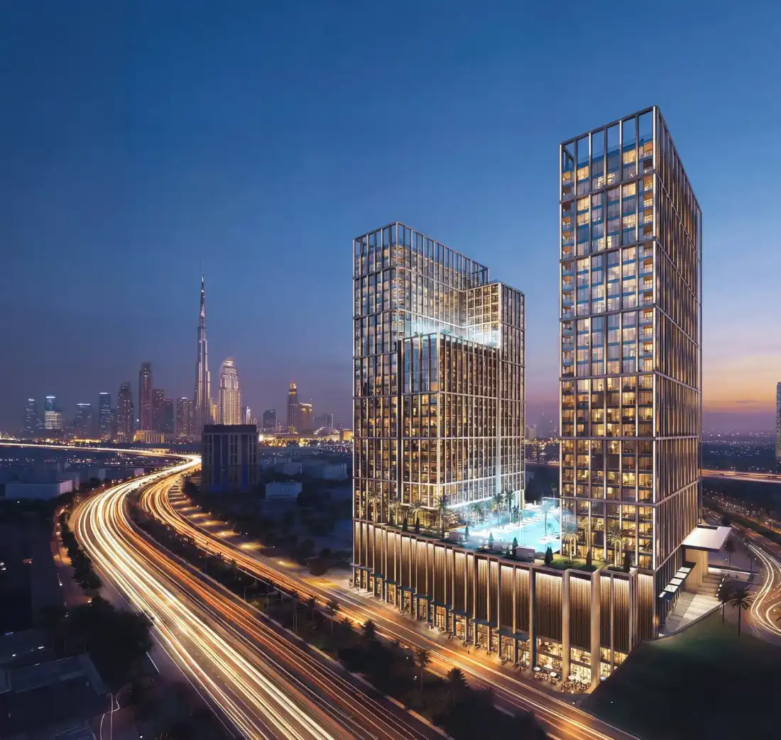 Binghatti Spectre twin towers in Al Jaddaf at dusk with Dubai skyline