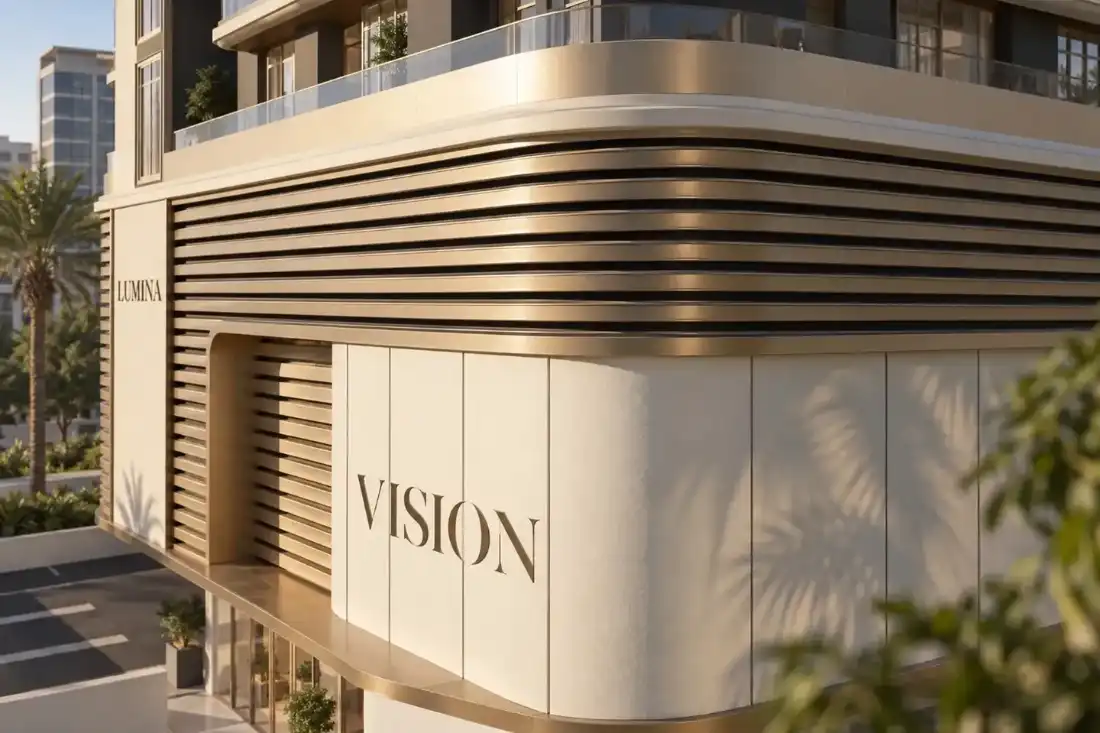Lumina by Vision building entrance with curved façade and horizontal detailing